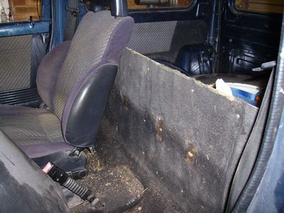 Rear bulkhead covered in carpet removed from the rear