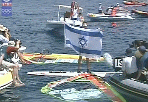 Gal Friedman holds up Israeli flag