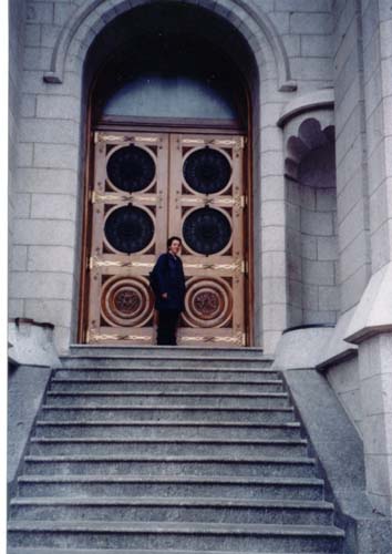 by the doors.