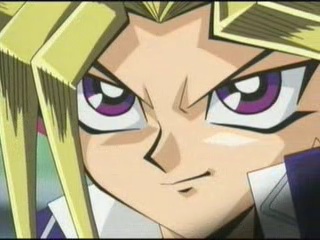 Smirking in a cool manner. If you were to judge by this, you'd never guess that he's probably shorter than you.