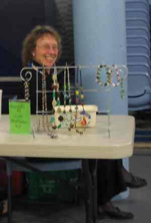 Bryony - sitting back   letting the music waft over her whilst selling jewellery at the entrance.