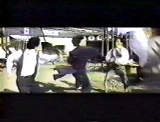 Jackie uses Drunken Boxing techniques to fight off a gang of opponents