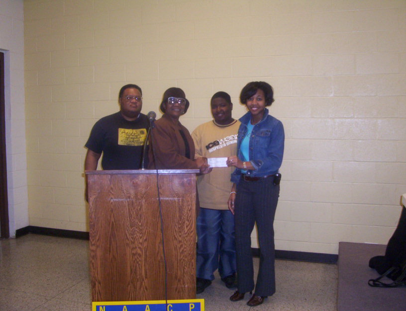 Youth donate to All is Well Homeless Shelter, Mrs. Yolanda Jones accepts
