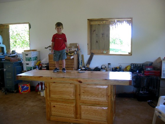 My son on top of the new workbench