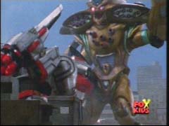 Doomtron knocks the Quantasaurus Rex to the ground