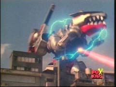 Red Ranger uses the Quantum Defender to disable Q-Rex's trizirium crystals