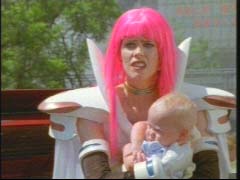 Nadira saves a baby that has been lost in the attack