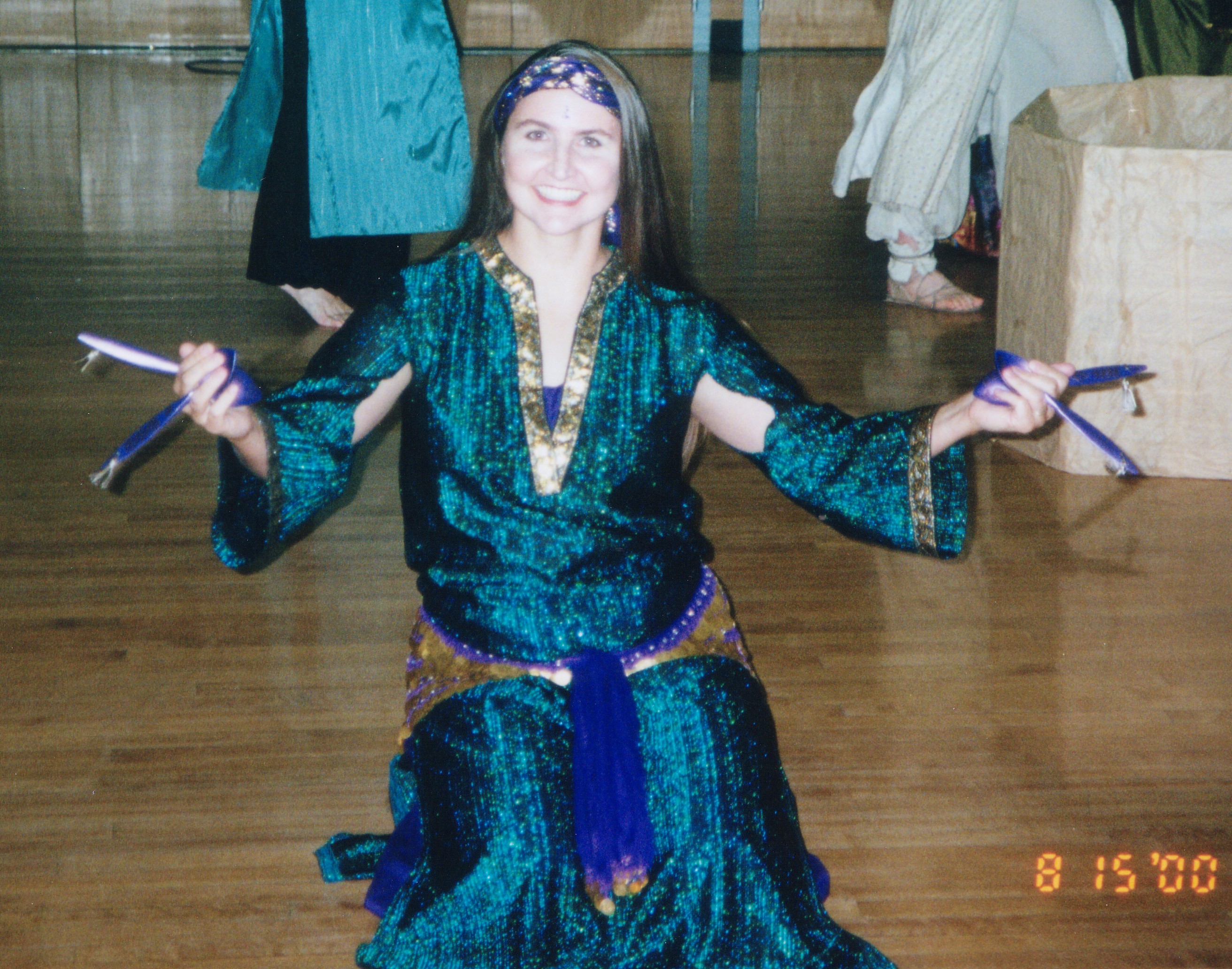 Shadyaa performing with wooden spoons