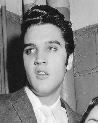 A young Elvis looking a bit surprised.