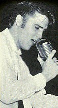 A young Elvis singing.