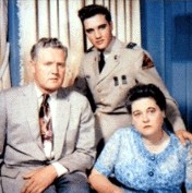 Elvis with his parents while at Fort Hood.