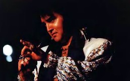 A candid Elvis onstage.