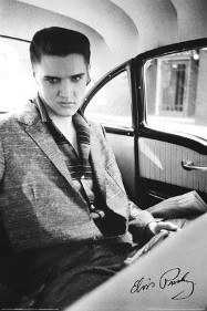 A young Elvis riding in a car.