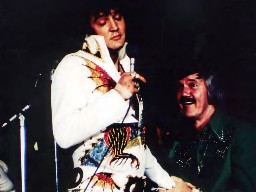 Elvis onstage with JD Sumner.