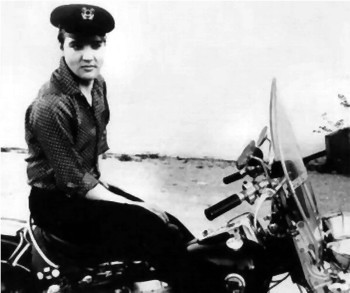 Elvis atop his motorcycle.