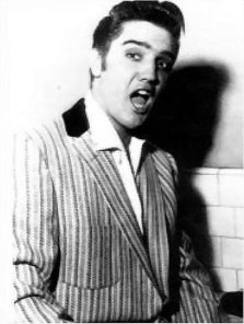 Elvis clowning around backstage.