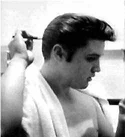Elvis combing hair.