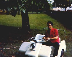 Elvis riding on his golfcart