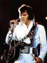 Elvis holding microphone.