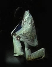 Elvis kneeling on stage