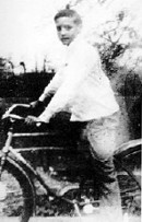 Elvis on bicycle as a young boy.