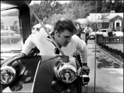 Elvis sitting on his motorcycle.