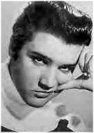 A young Elvis posing for the camera.