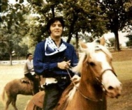 Elvis riding his horse Rising Sun