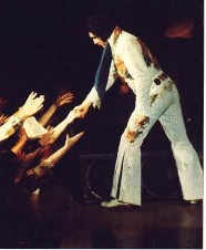 Elvis shaking fans' hands