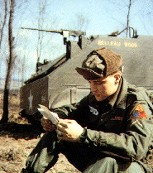 Elvis reading fan mail while in the army.