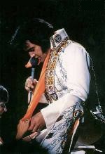 Elvis touching a fan's hand