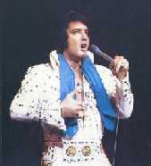 Elvis wearing a blue scarf onstage