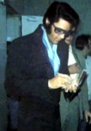 Elvis signing autographs