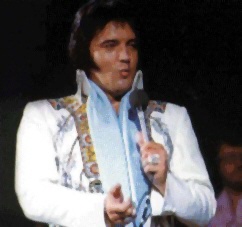 Elvis on stage with a look of "trouble" on his face