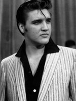 A young Elvis wearing a striped jacket.