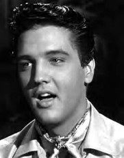 Black and white photo of Elvis in the 50s.