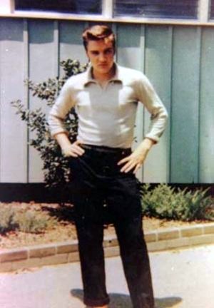 A young Elvis posing for the camera.
