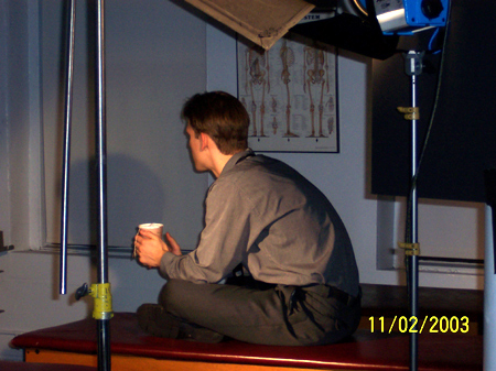 Chris sits and thinks.