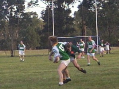 Brendan Scandrett is tackled to the ground against Sarsfields