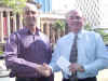 Rob Matchett (right) presents Shamrocks president David Duguid with the Access Ireland Holidays sponsorship cheque at Brisbane City Hall