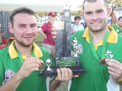 Paul Daly (left) with friend Stephen Melody with the Queensland League trophy won in 2005