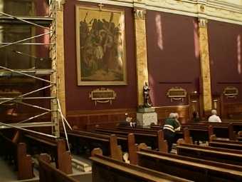 Part  of left hand wall of church with four stations removed for restoration