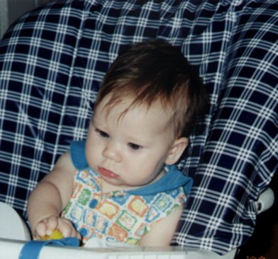 "Me in my new highchair - So when do I get the good food."