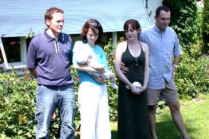 ... Mum & Dad, my God-mother Sandra holding me in her arms and my God-father Olivier next to her.