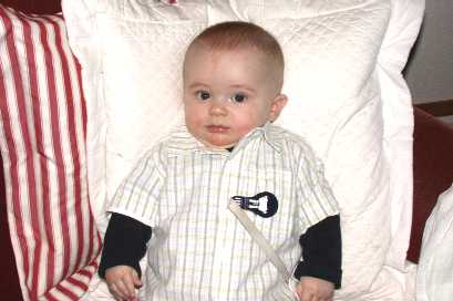 Yeah right... You try to smile when you're stuck in a stiff shirt like that!