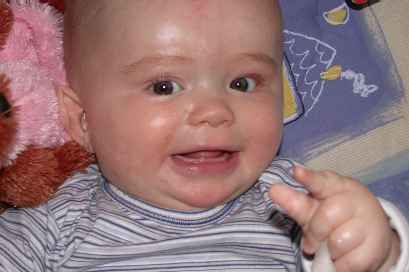 LOOK... I got my first tooth!... Dad's soooo proud!
