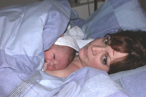 ... not yet an hour in this world... at least I'm fine with Mommy...
