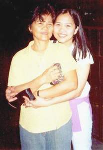 My mama and me at the airport last May 4, 2002. Saying goodbye and see you next year!