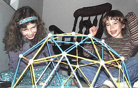Kathry and Vincent laughing over geodesic dome made with Zome