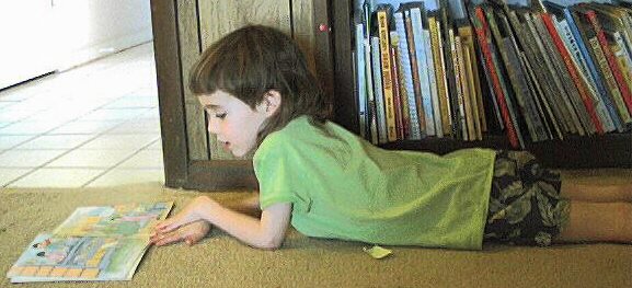 Vincent reading a Magic School Bus book